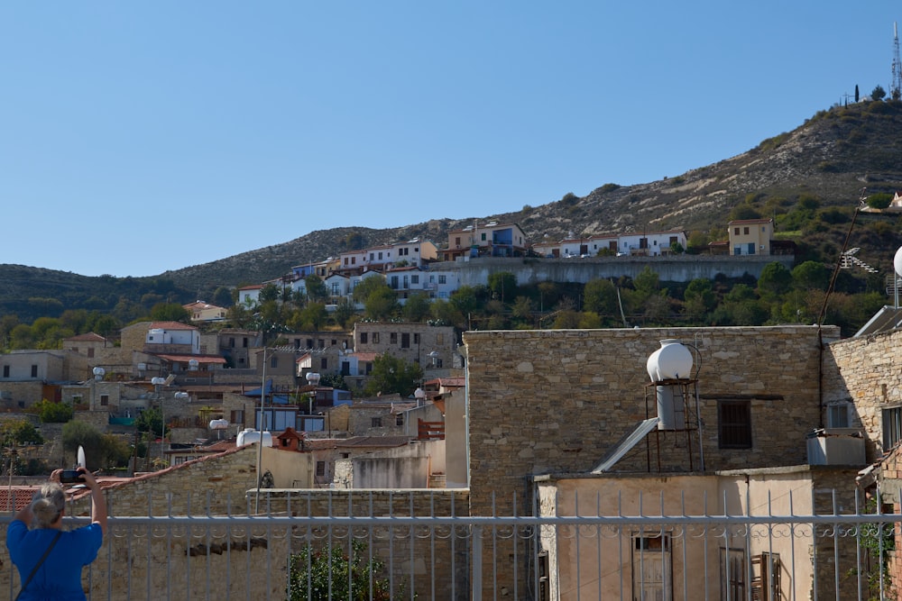 a hillside with buildings and trees