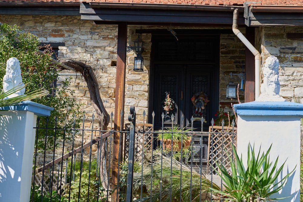 a house with a fence and plants