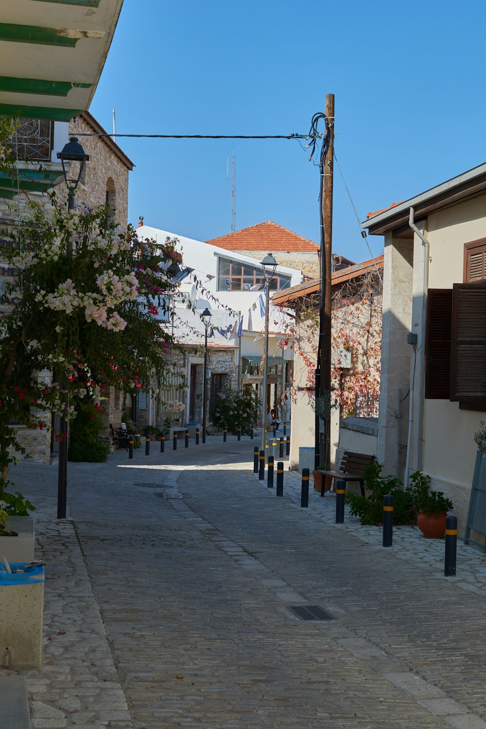 a cobblestone street with buildings on either side of it