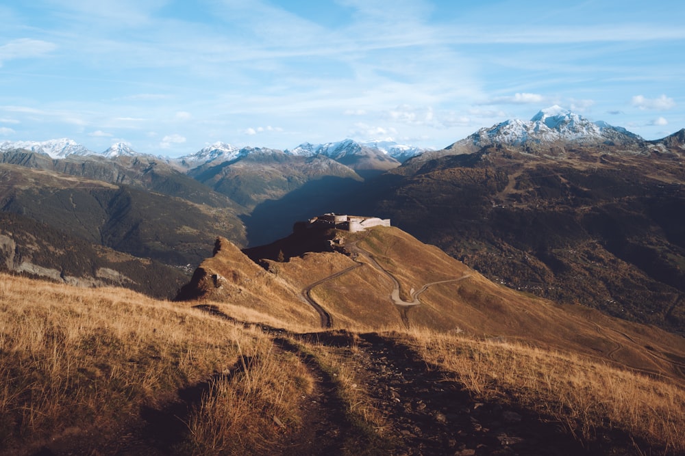 a landscape with mountains in the back