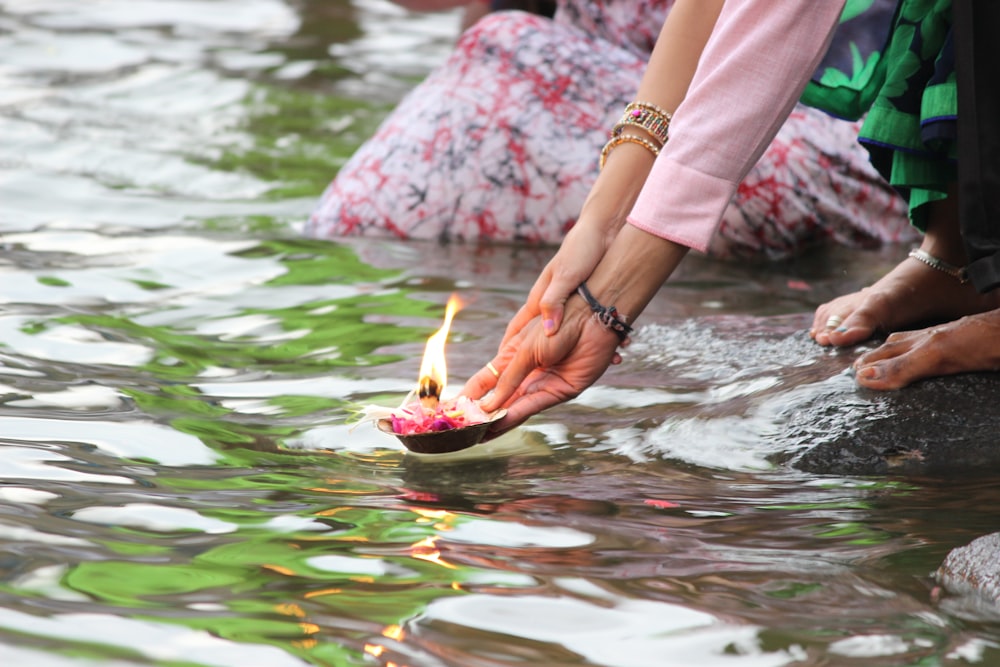 a person holding a fish in water