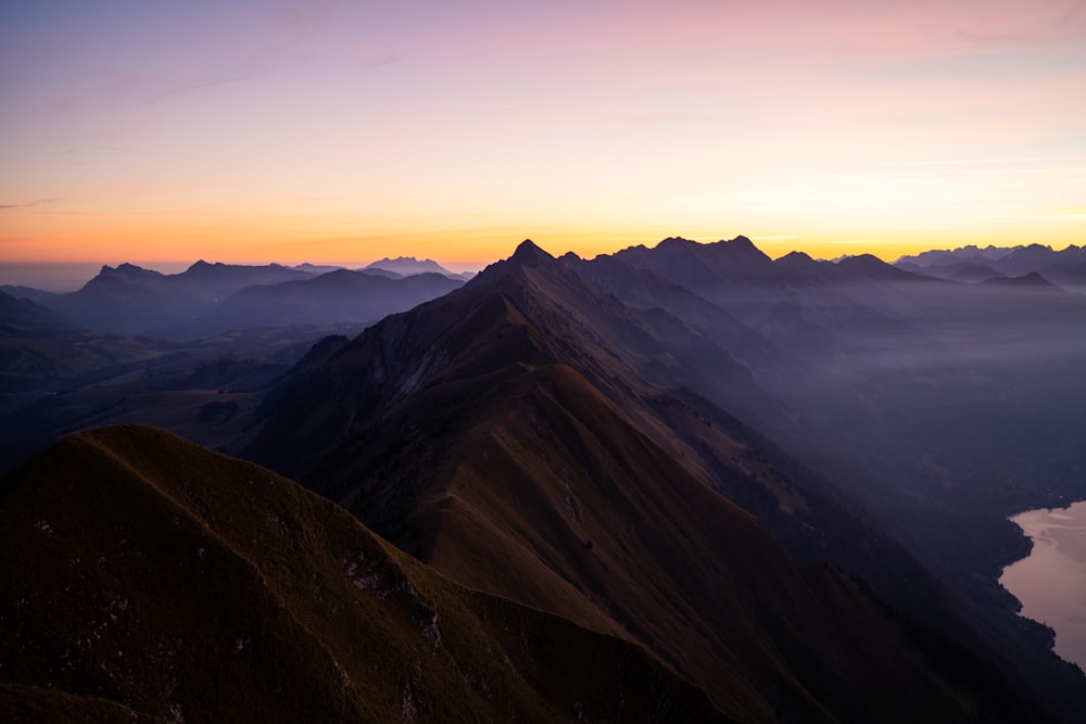 a view of a mountain range at sunset