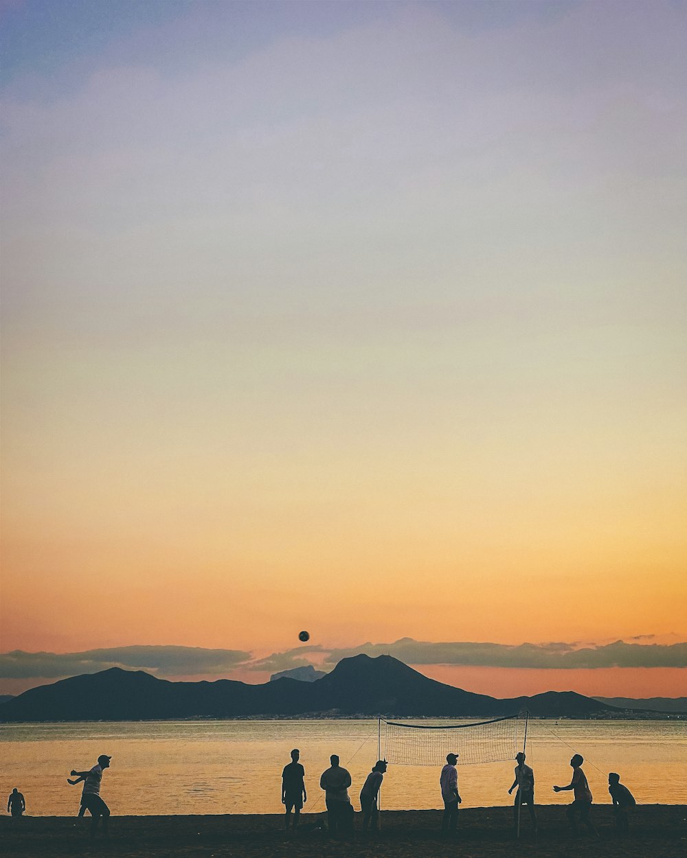 a group of people on a beach