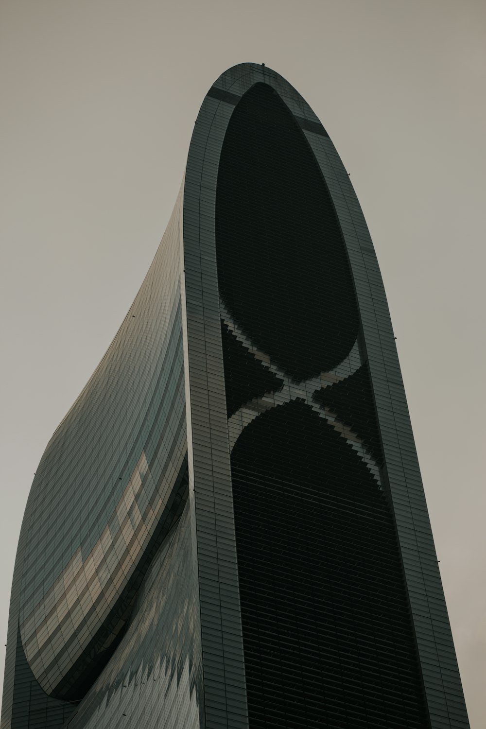 a tall building with a curved top