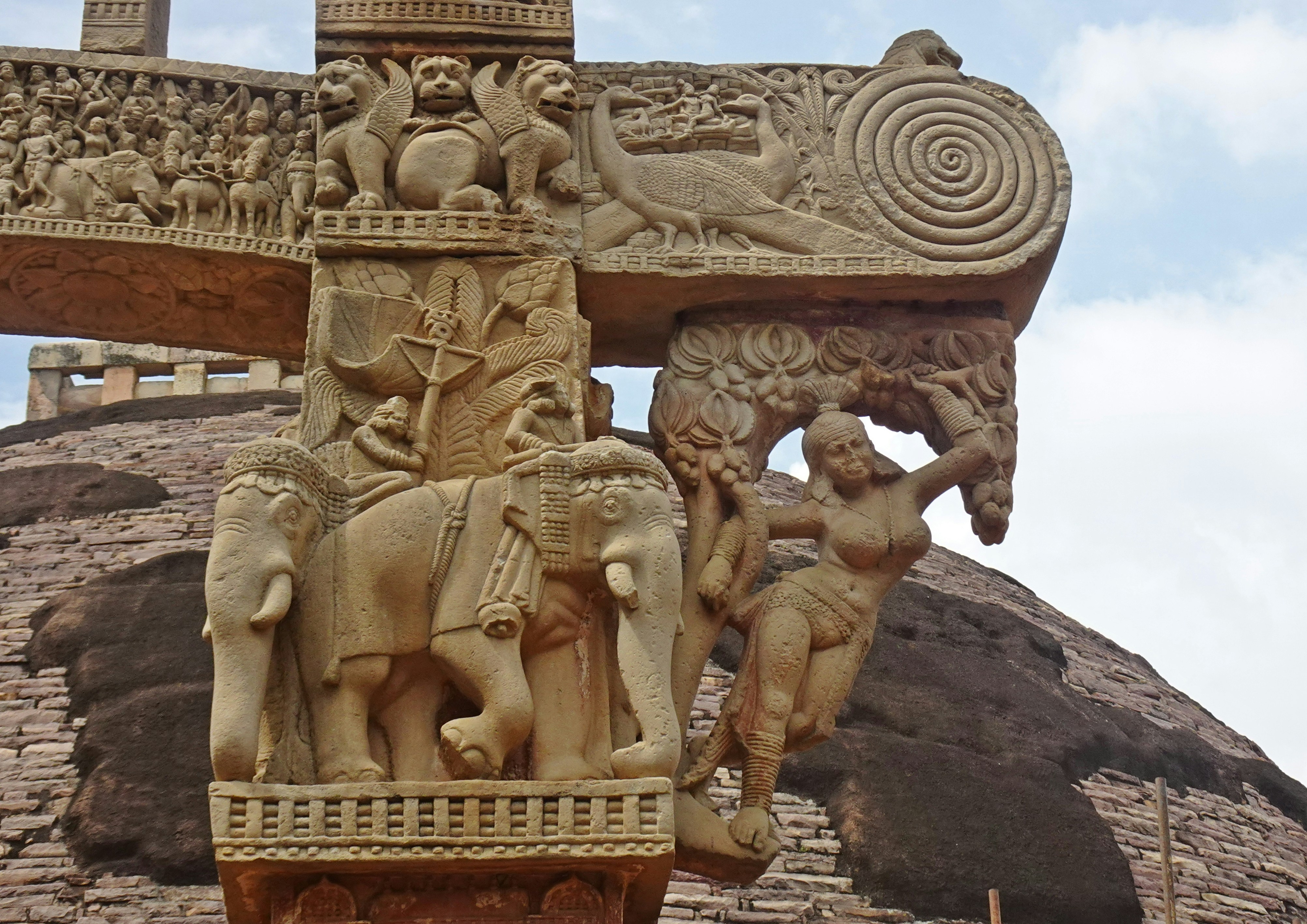 a stone sculpture of a group of people
