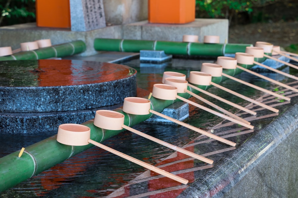 a group of small cups with straws in them