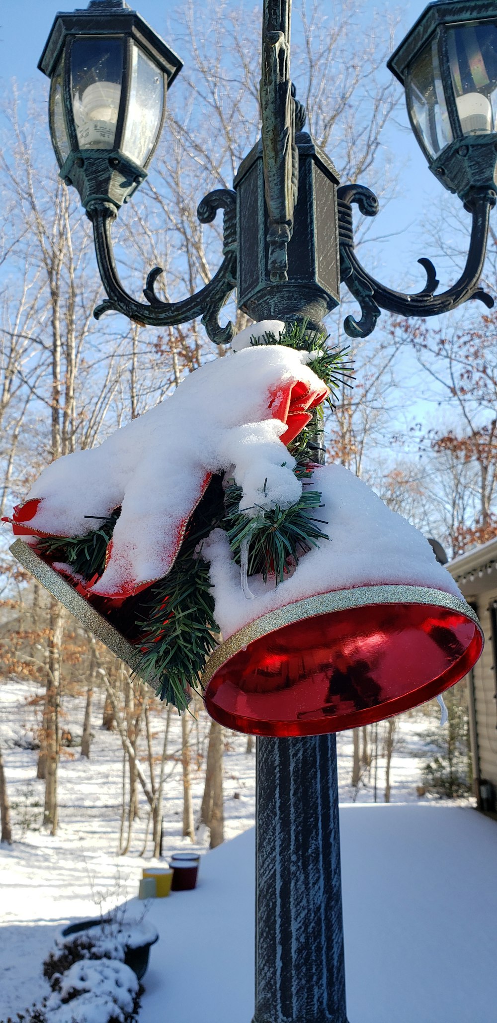 a snow covered lamp post