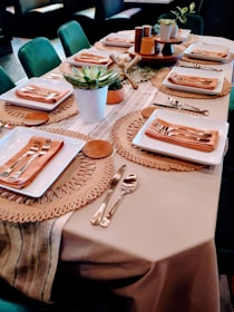 a table with plates and silverware