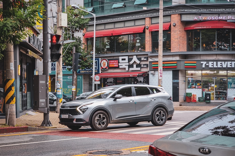 a silver car on the street