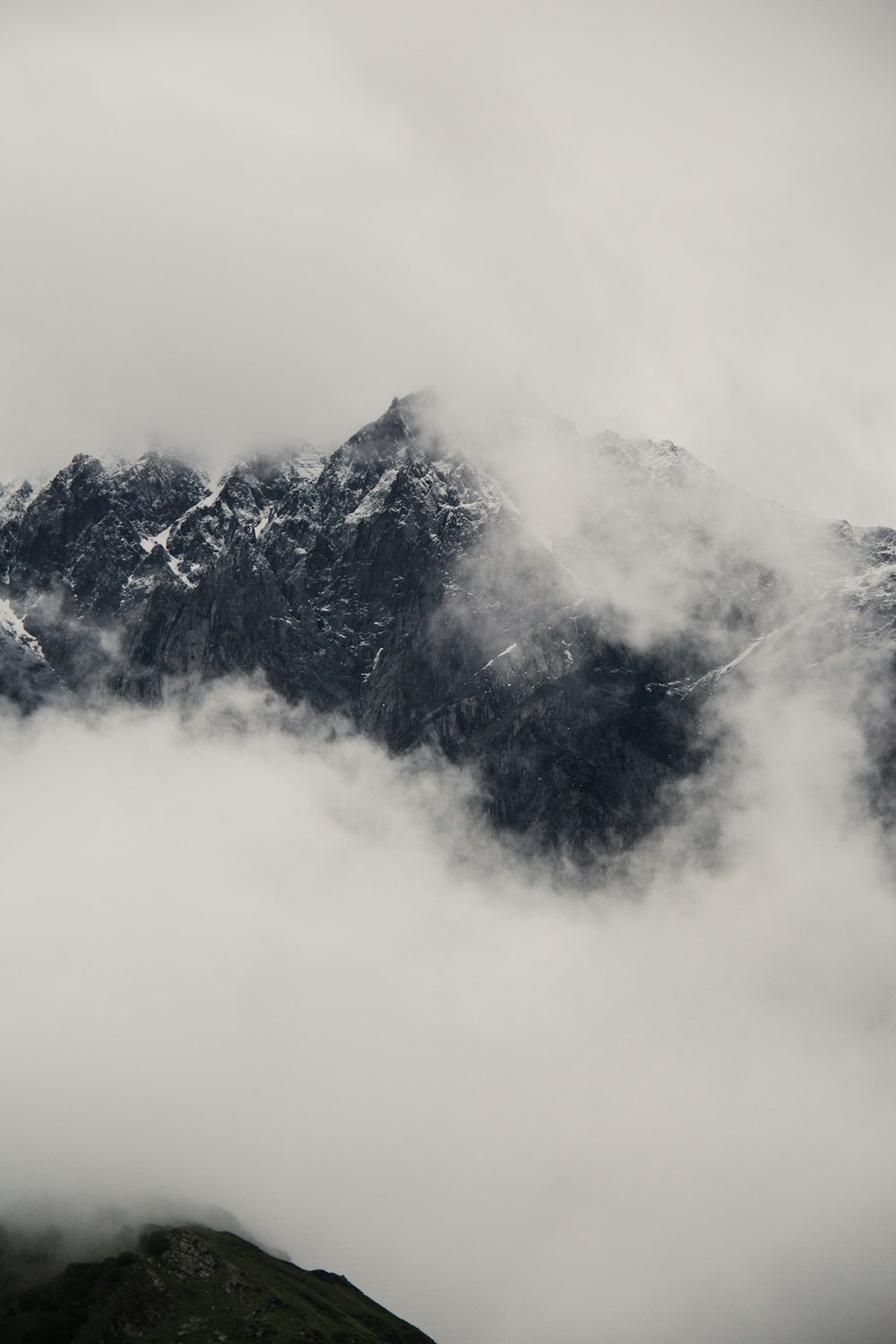 a mountain covered in clouds