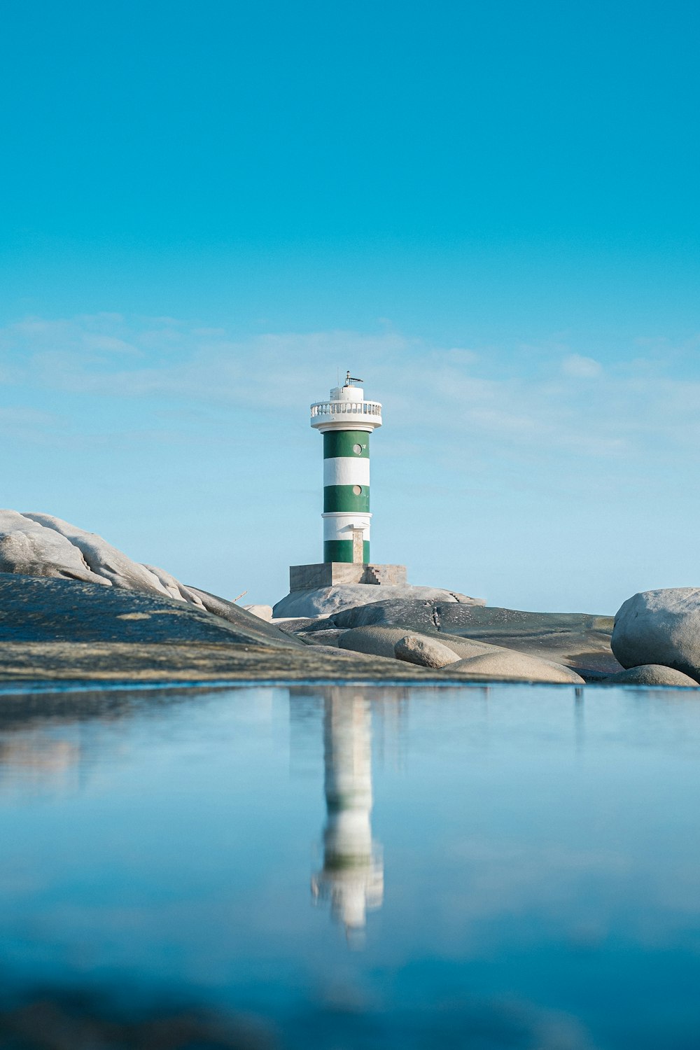 a lighthouse on a rocky island