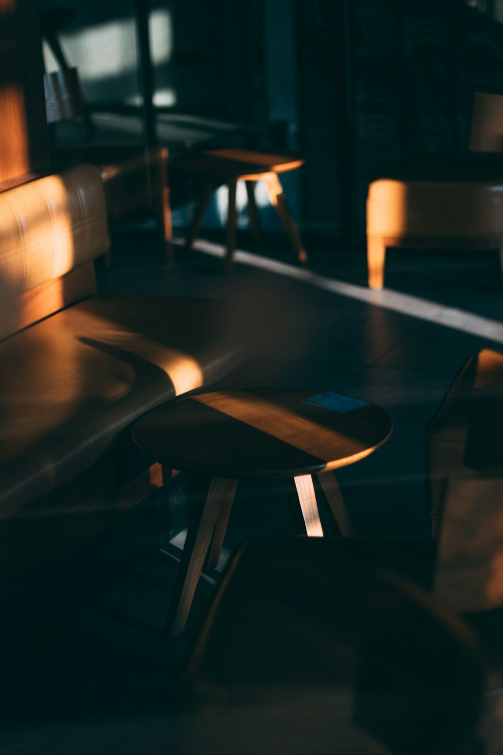 a table and chairs in a dark room