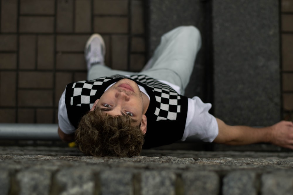 a person lying on a ledge