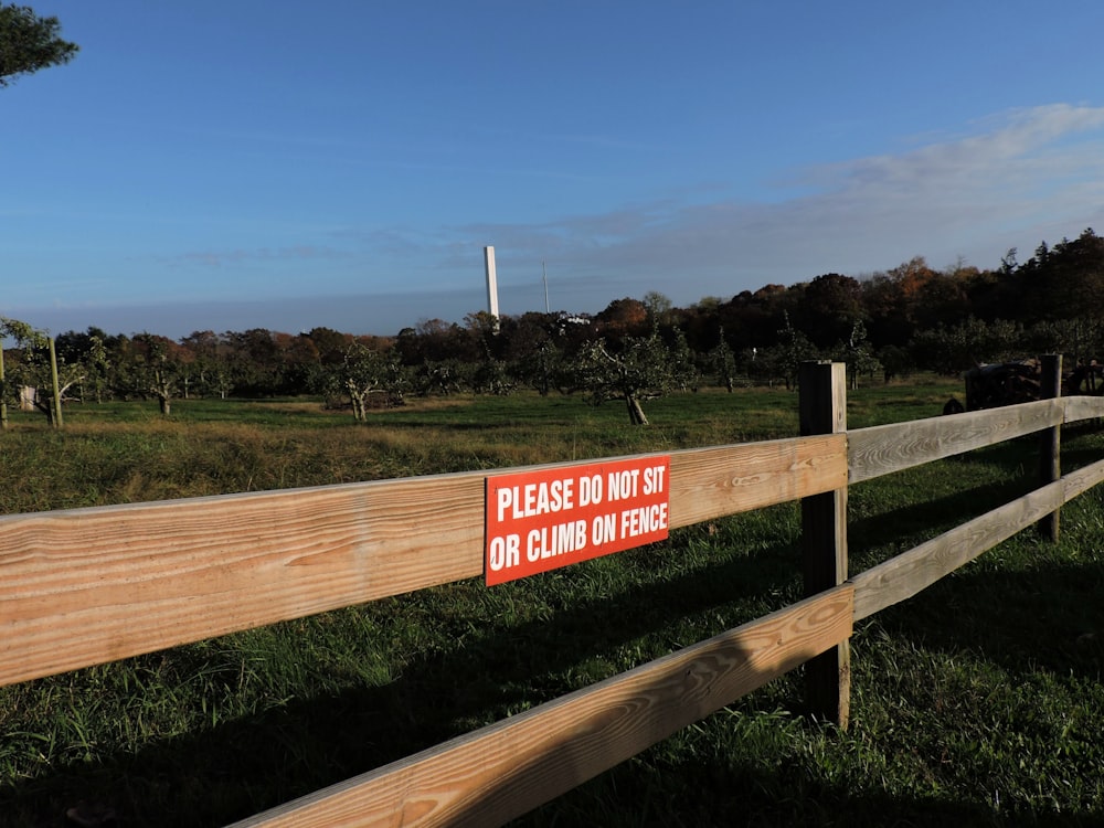 a sign on a fence