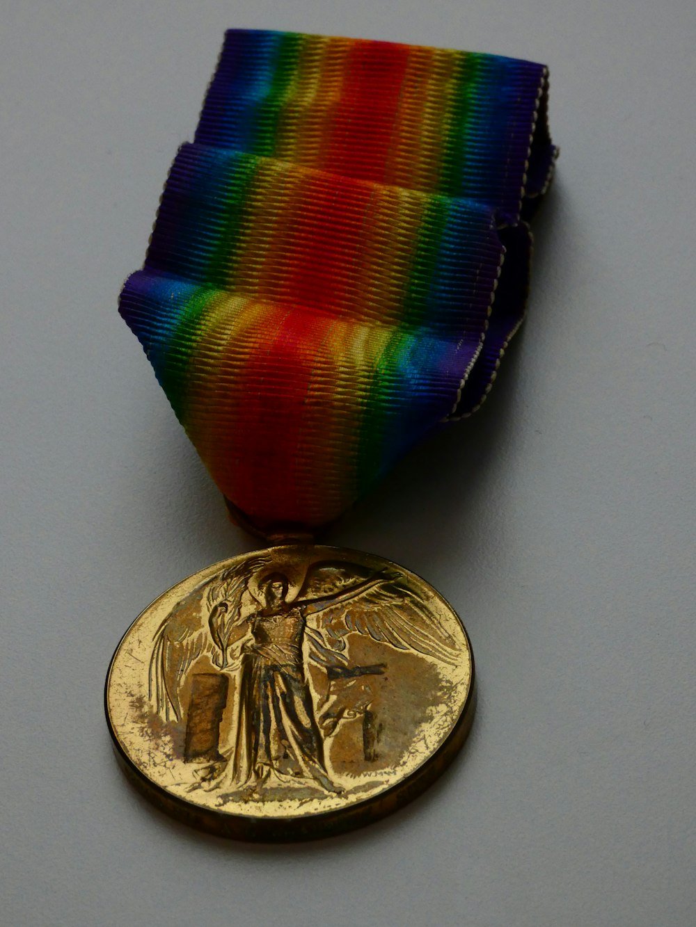 a coin next to a medal