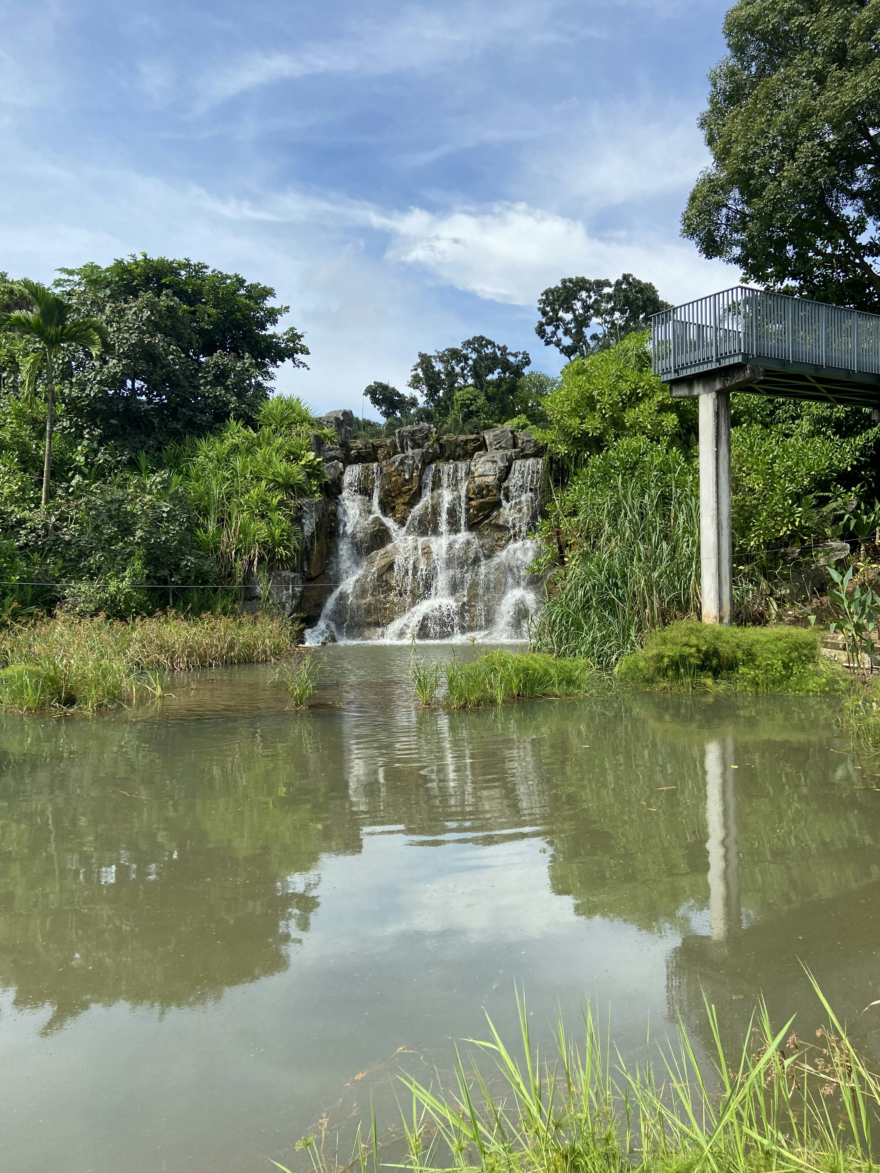 a waterfall in a pond