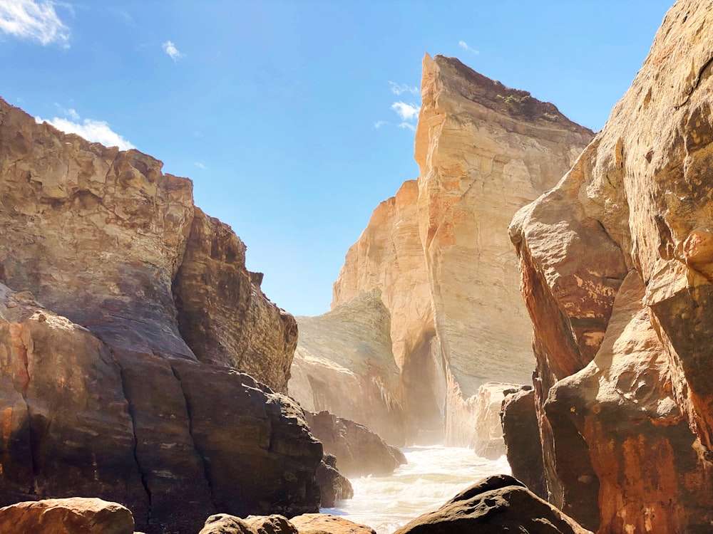 a rocky canyon with a river running through it