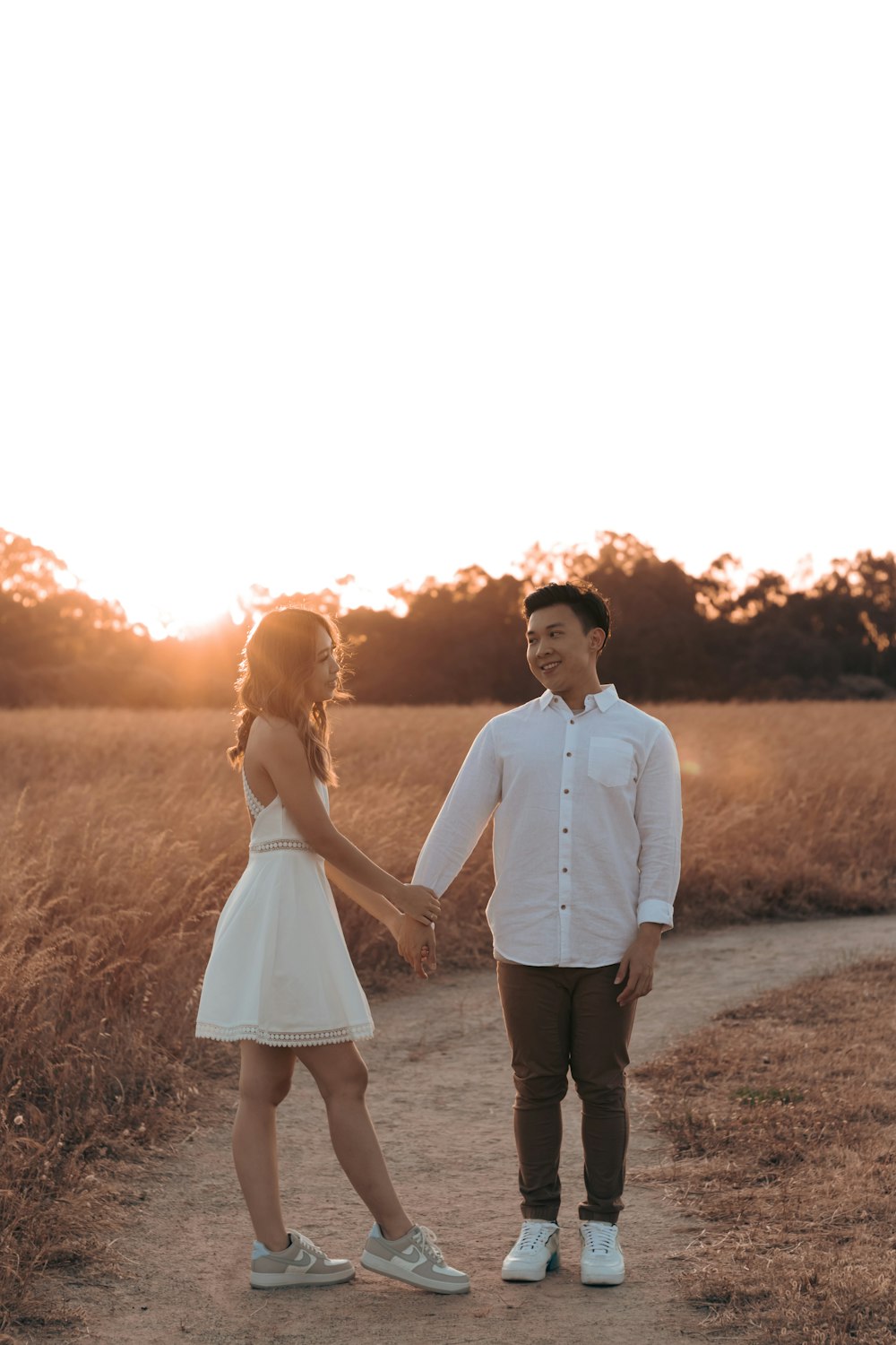 a man and woman holding hands