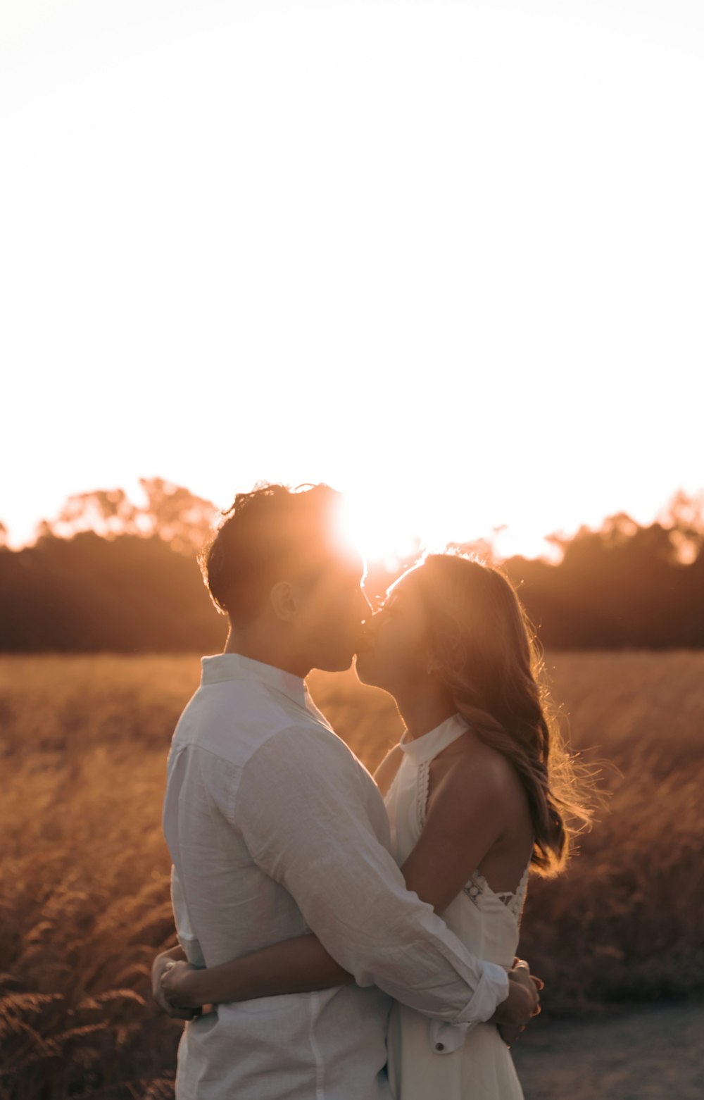 a man and woman kissing