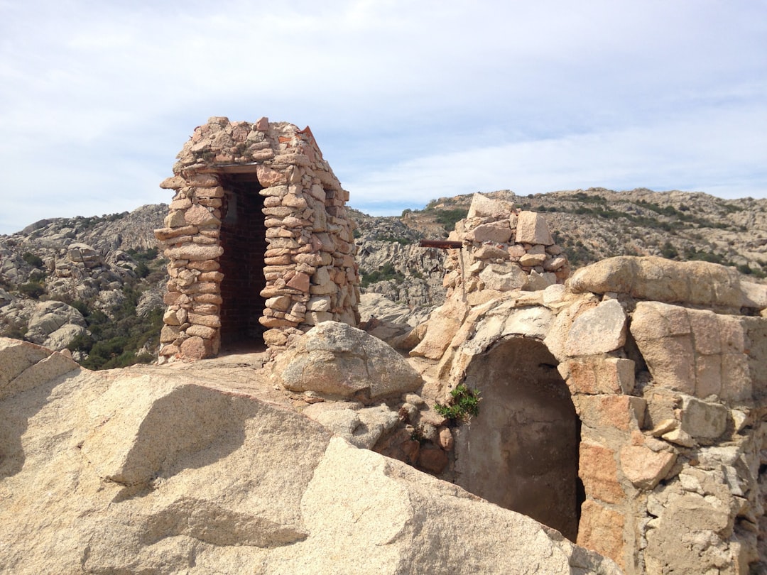 a stone building in the desert, Walking into