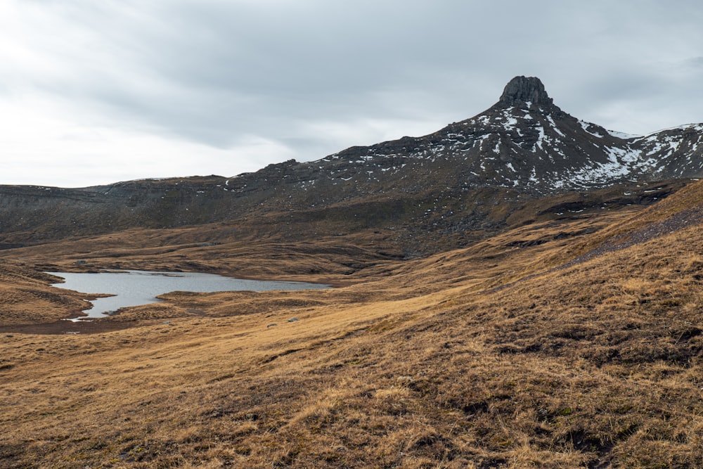 a mountain with a lake in front of it