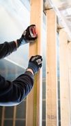 a person wearing black gloves