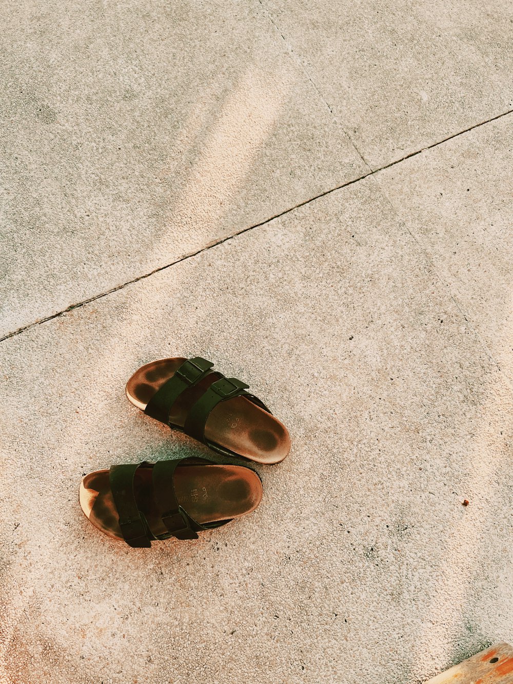 a pair of shoes on a concrete surface