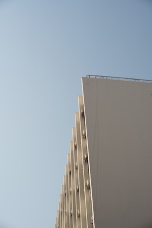 a tall building with a crane