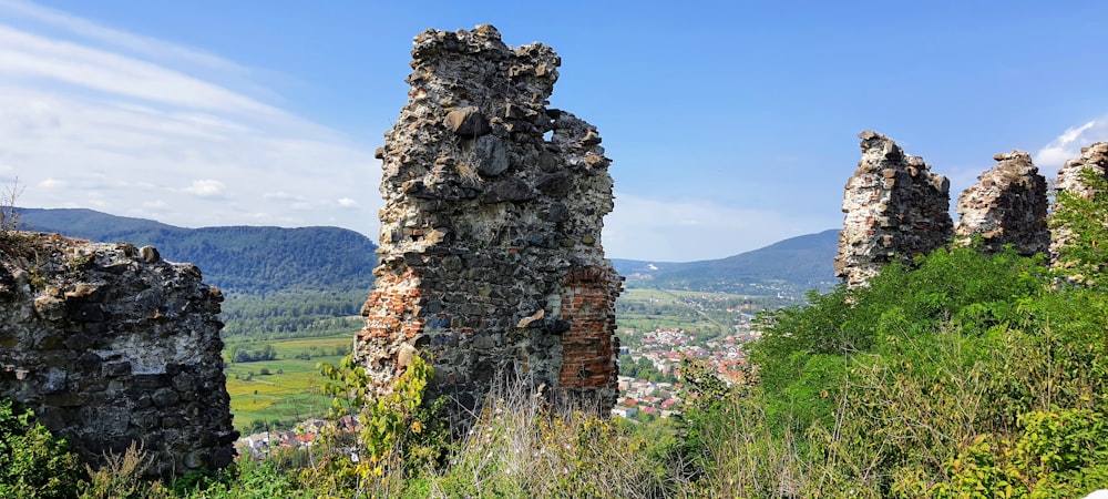 a stone structure on a hill