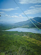 Wide shot of a clean water reservoir surrounded by green landscape