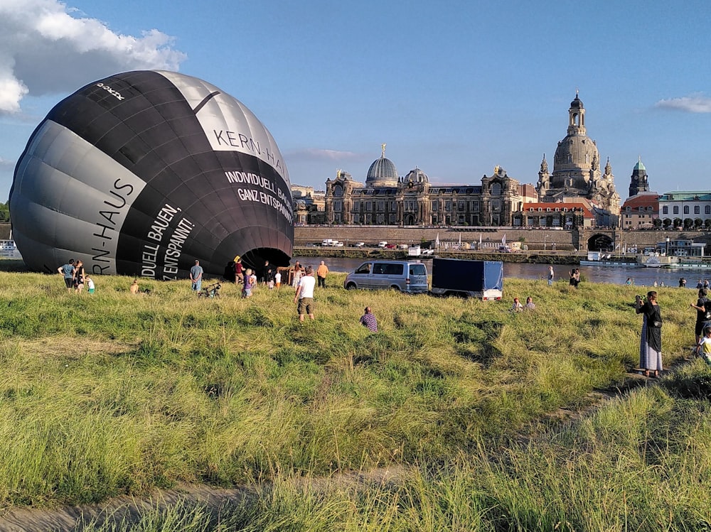 a large black and white balloon in front of a castle