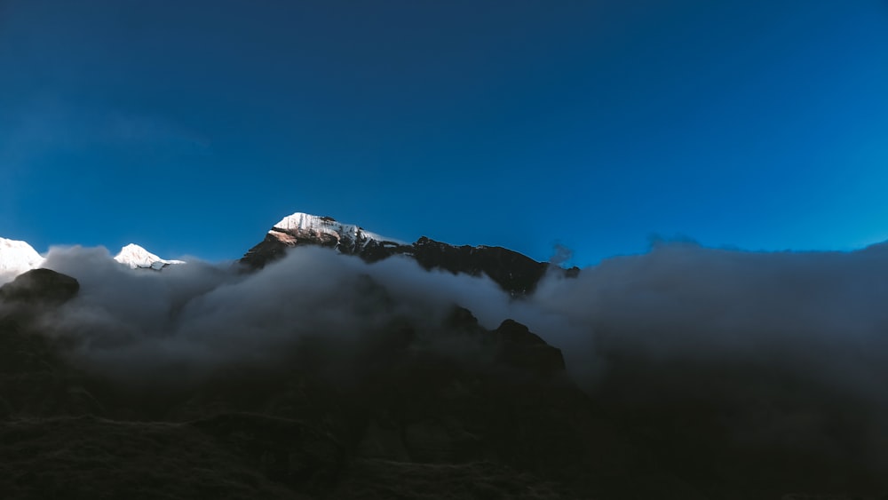 a mountain covered in clouds