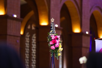a vase with flowers in a church