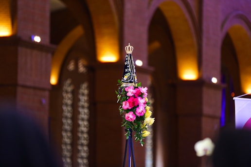 a vase with flowers in a church