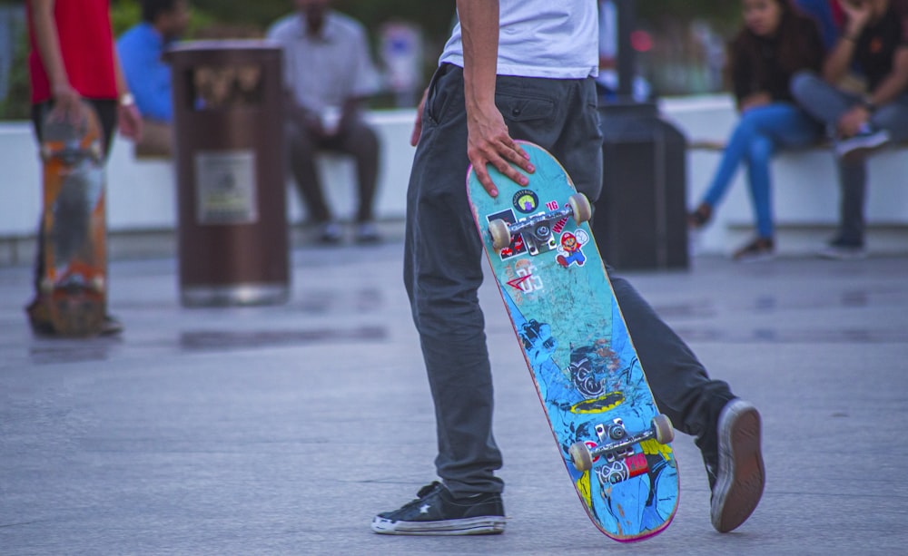 a man holding a skateboard