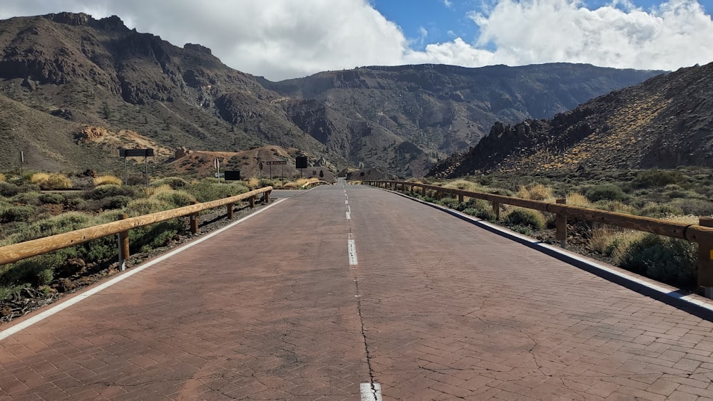 a road with mountains in the background