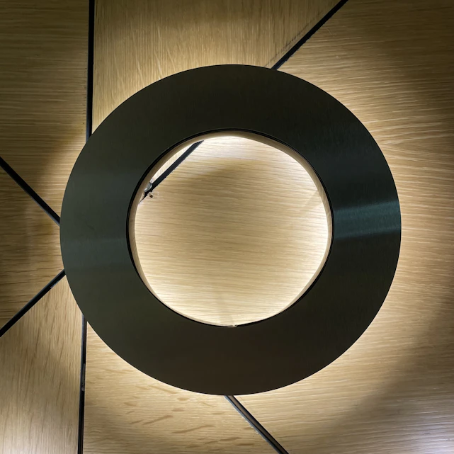 a circular object on a wood surface