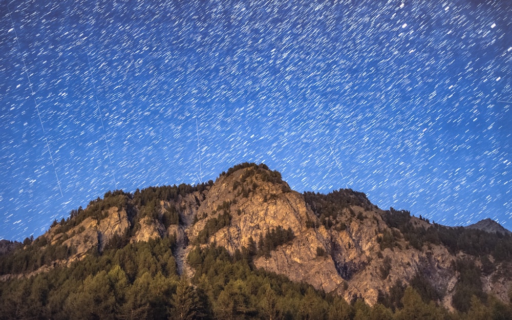 a mountain with a starry sky above it