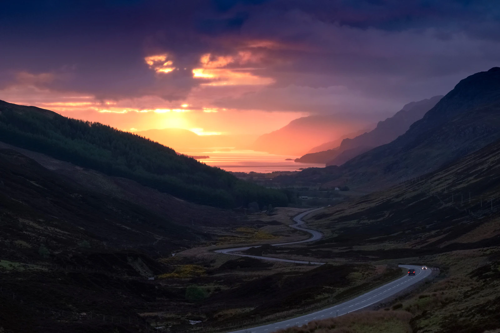 A winding road through a Highland valley on the North Coast 500