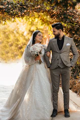 a man and woman in wedding attire