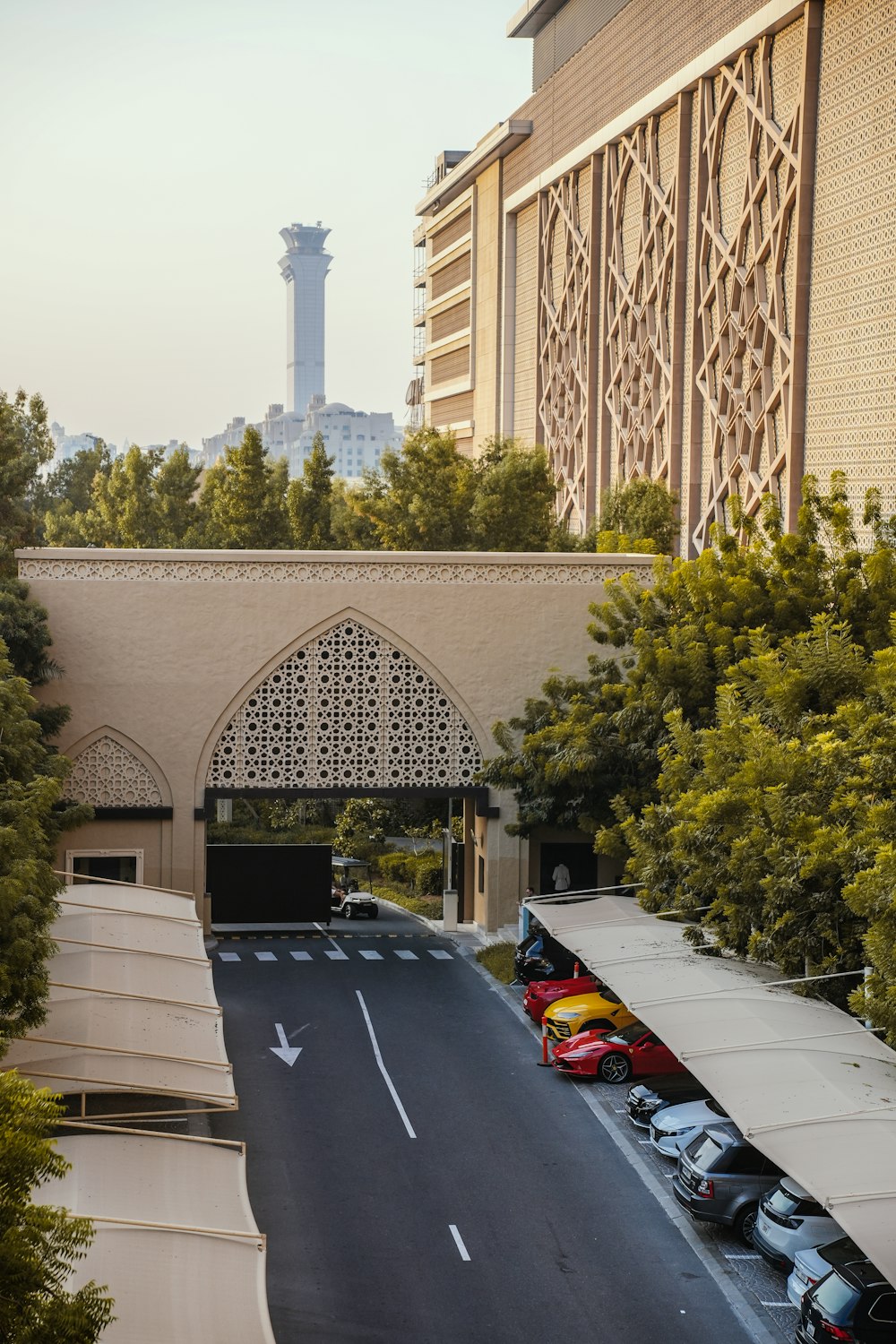 a road with cars and a building