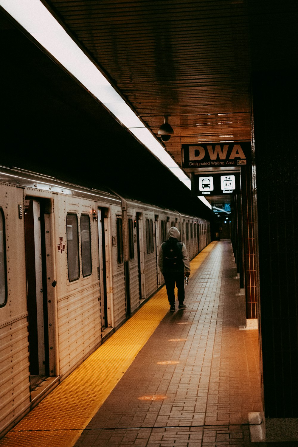 a person walking down a train platform