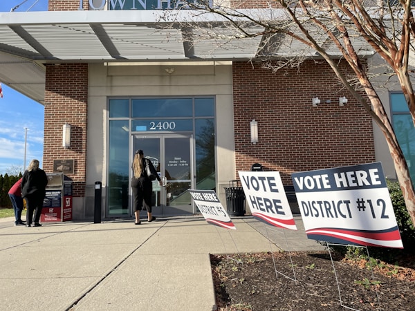 Voters gather outside a building to cast ballots, the kind of civic turnout that decides CCSD trustee seats