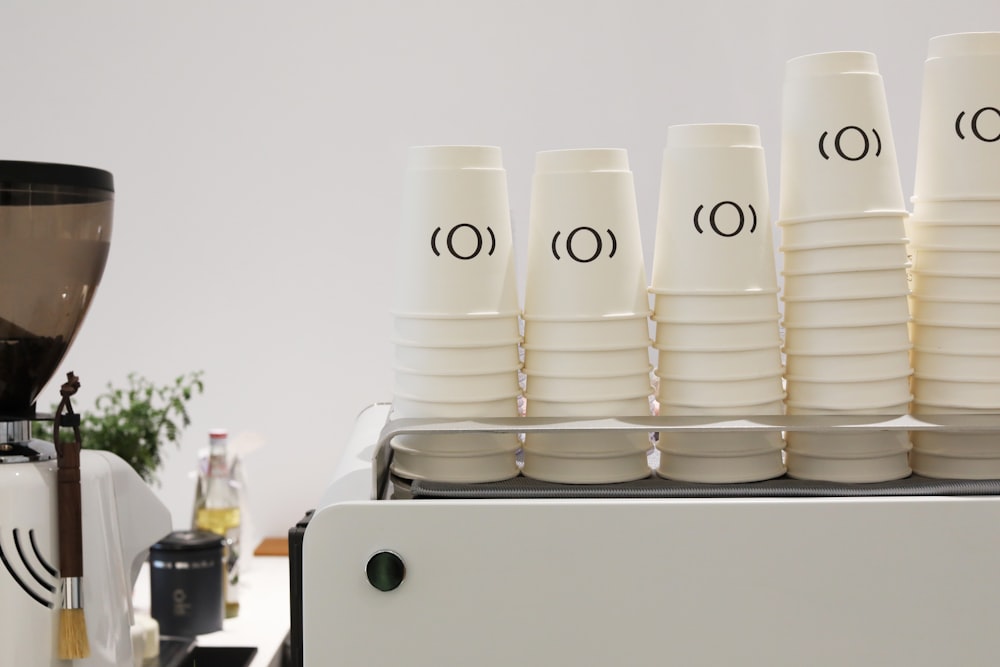 a stack of white cups
