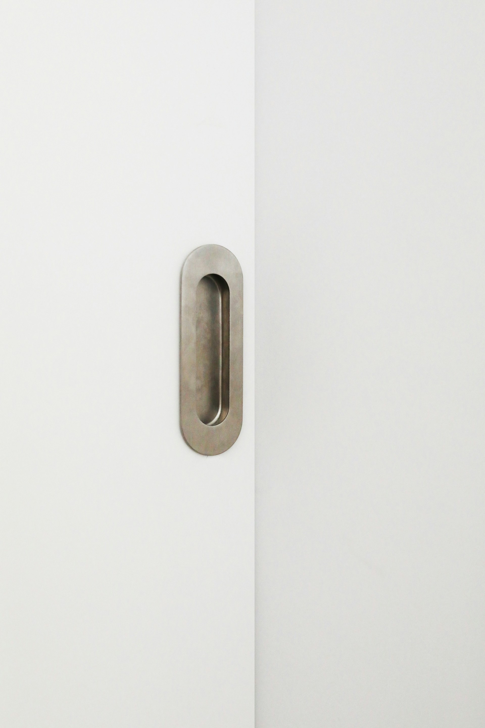 a door handle on a white wall