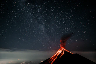 A vibrant 3D model of a volcanic eruption under a starry night sky, showcasing intricate details and cosmic elements.