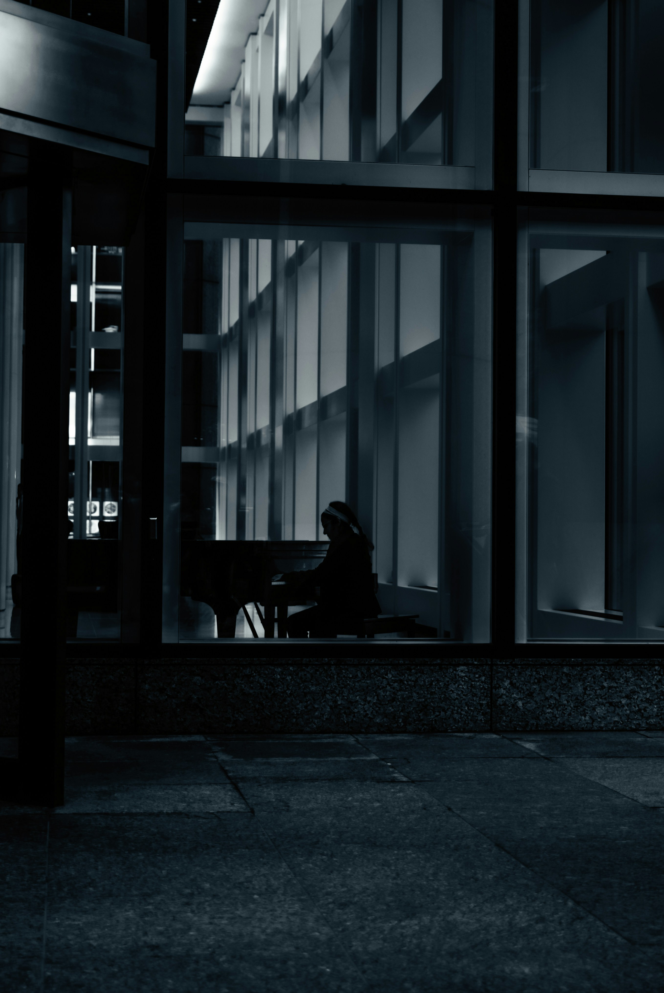 A person sitting outside a building photo – Free Art Image on Unsplash