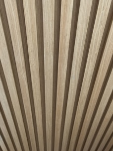 Wall paneling in rich wood tones, highlighting natural textures and craftsmanship.