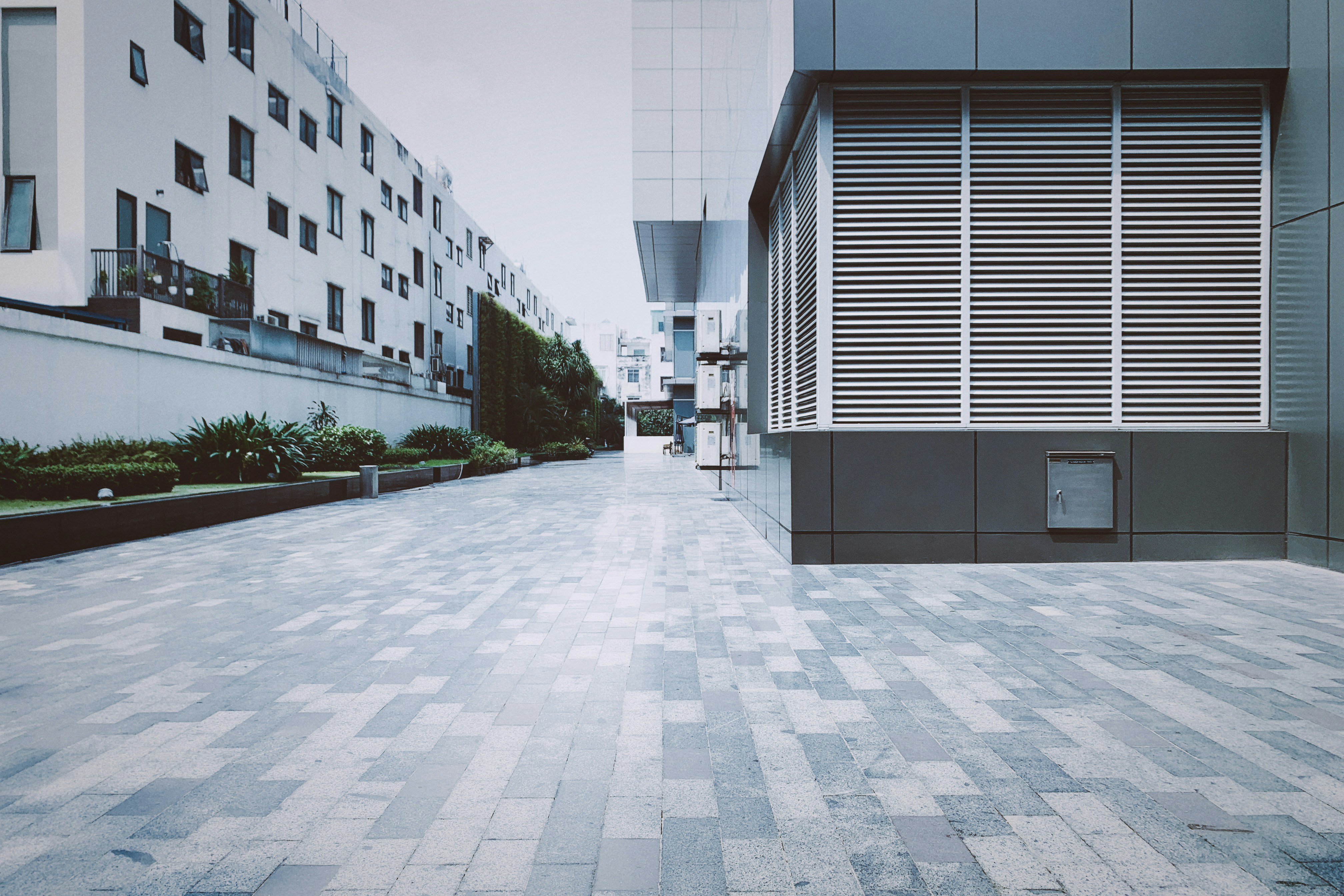 a courtyard with buildings in the background