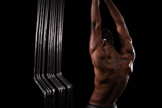 Close-up of a fitness athlete stretching muscles after a workout session.